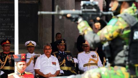 Sri Lanka"s President Gotabaya Rajapaksa (C) looks on as military personnel parade during Sri Lanka"s 72nd Independence Day celebrations in Colombo on February 4, 2020.