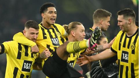 Jude Bellingham (second left) and the Borussia Dortmund players celebrate victory