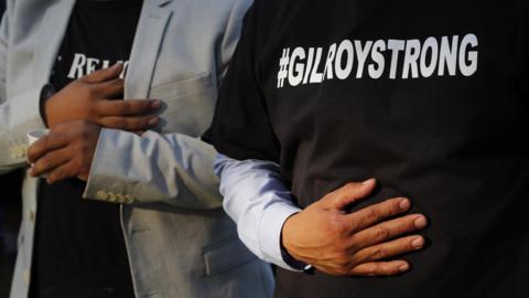 Gilroy residents behind the Gilroy City Hall during a vigil for victims