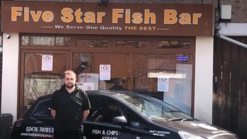 Stuart Cooper outside his shop