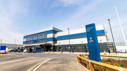 The Police Investigation Centre in Portsmouth - a block with blue and grey stripes across the front and large windows above the entrance.