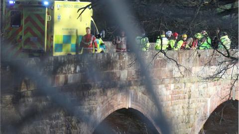 Emergency services staff were looking near the road bridge at Aberbechan