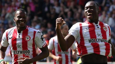 Michael Kayode celebrates