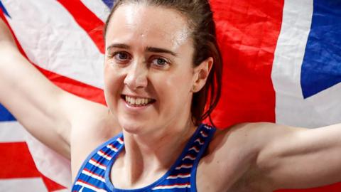 Laura Muir holds up a British flag