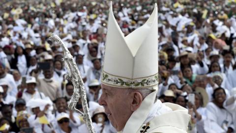 The Pope with a crowd behind