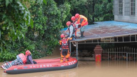 Rescuers helping residents
