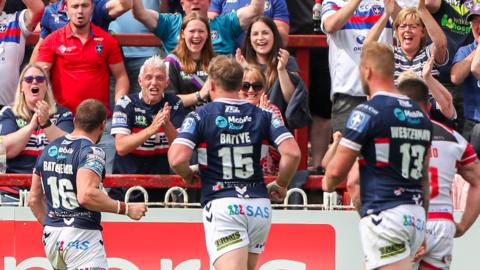 James Batchelor celebrates his try