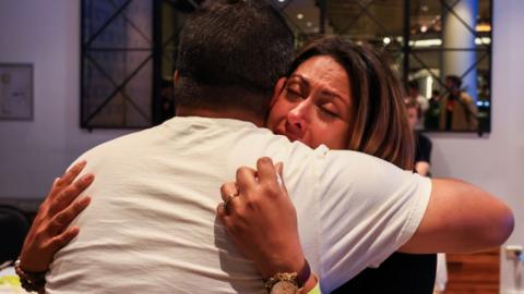 Campaign Director of Yes 23 Dean Parkin hugs a Yes supporter after his speech at the Inner West for 'Yes2023' official referendum function at Wests Ashfield Leagues Club