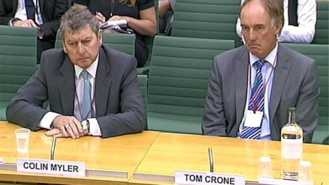 2011 photo of Colin Myler and Tom Crone giving evidence to the Commons Culture, Media and Sport Committee about phone hacking.