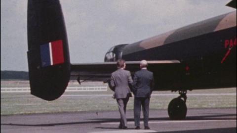 Two men standing by the wing of a Dambuster.