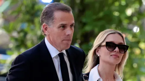 Hunter Biden, son of U.S. President Joe Biden, arrives with his wife Melissa Cohen Biden at the federal court for his trial on criminal gun charges, in Wilmington, Delaware,