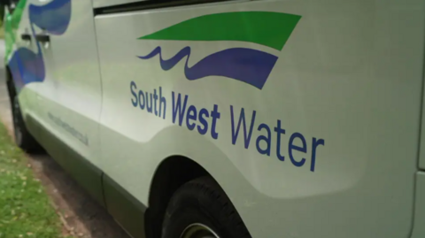 A picture of the side of a white South West Water van. It has the water company logo. 