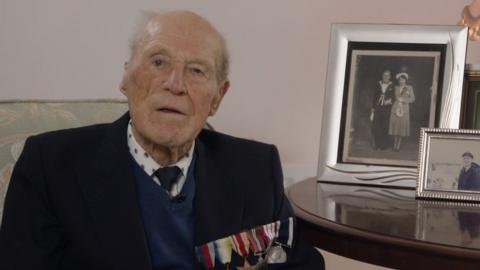 Len Chivers, 99, sat at home surrounded by pictures of his family