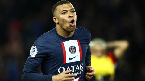 Kylian Mbappe celebrates scoring for Paris St-Germain against Lens in Ligue 1