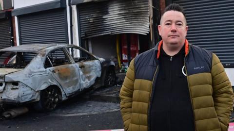 Ciaran Kelly, the takeaway owner, outside the shop