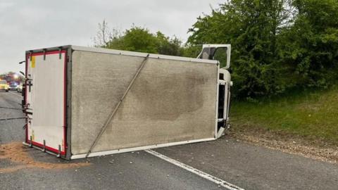 Overturned lorry on the M11
