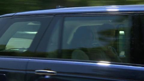 Harry and Meghan drive past