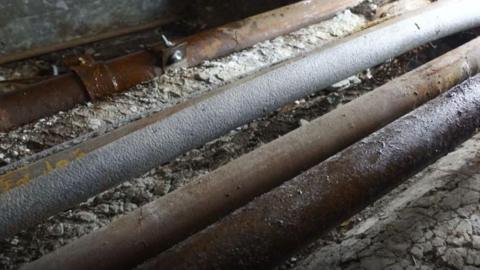 A row of old metal pipes