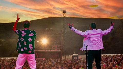 Boyzlife stars Keith Duffy and Brian McFadden perform to thousands of people as the sun sets at their Féile an Phobail concert