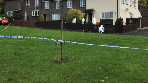 Forensic officers in Slievecoole Park on Monday