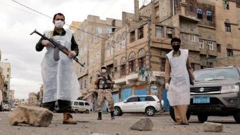 Masked security officers patrol the streets of Sanaa, Yemen. Photo: May 2020