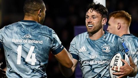 Leinster's Hugo Keenan celebrates scoring a try