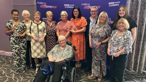 Group photograph of the winners of ý Radio Cumbria's Make a Difference Awards 2023