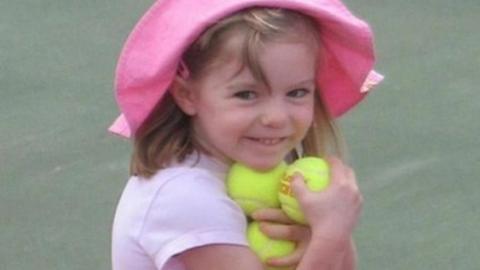 Madeleine McCann, holding several tennis balls, shortly before her disappearance