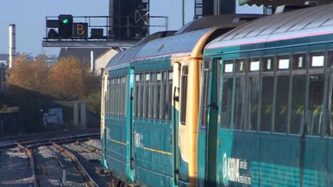 An Arriva train leaving a station