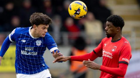 Perry Ng of Cardiff City and Tyreeq Bakinson of Cardiff City