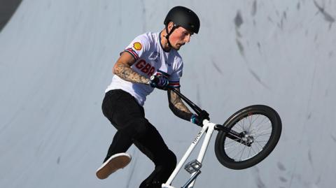 Dylan Hessey performs a trick on his BMX bike
