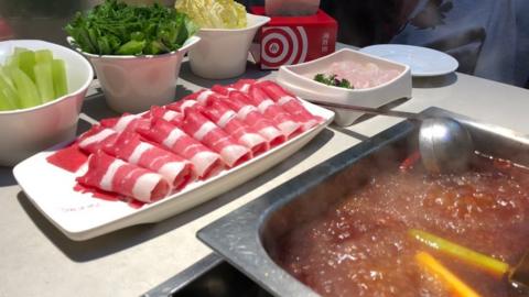 A Haidilao Hot Pot restaurant is seen at a mall on May 22, 2018 in Beijing
