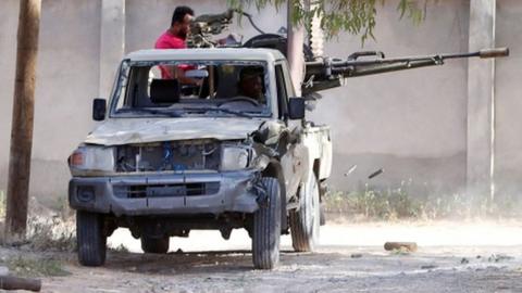 A file picture showing members of the Libyan government forces in a fight with Eastern forces in Tripoli