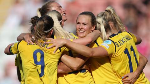 Sweden's players celebrate scoring against Portugal at Euro 2022