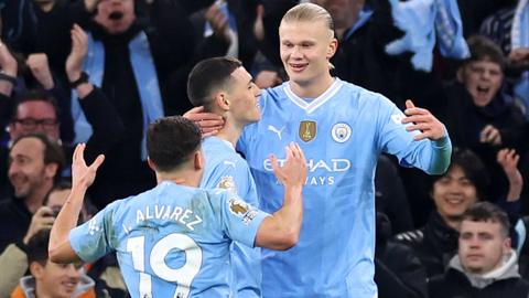 Erling Haaland celebrates with Phil Foden and Julian Alvarez after scoring for Manchester City against Brentford