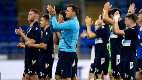 Tony Pennock and Haverfordwest players applaud the fans