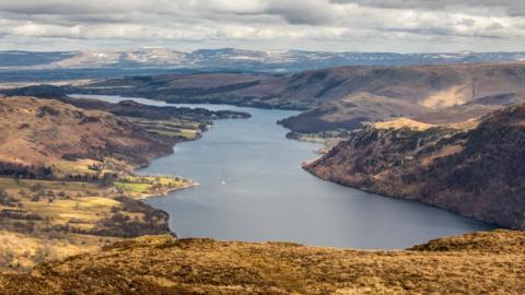 View from Sheffield Pike over Ullswater, a large lake surrounded by hills