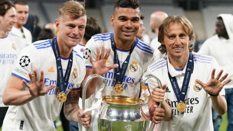 Toni Kroos, Casemiro and Luka Modric with the Champions League trophy after Real Madrid won it in 2022