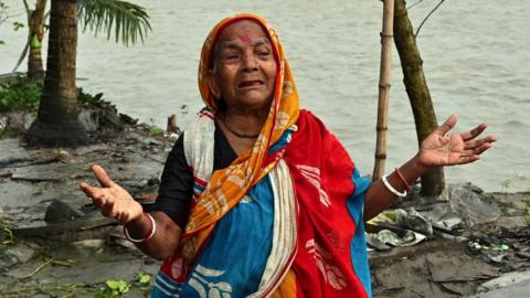 Woman crying amid floods