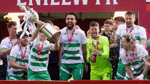 TNS players celebrate  