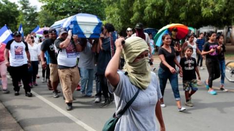 Demonstrators take part in funeral service of a man shot during recent protests in Nicaragua. Photo: 15 June 2018