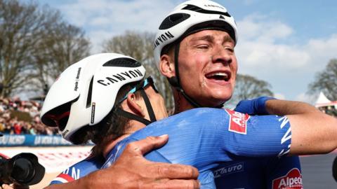 Mathieu van der Poel and Alpecin-Deceuninck team-mate Jasper Philipsen celebrate after finishing first and second at the 2023 Paris-Roubaix