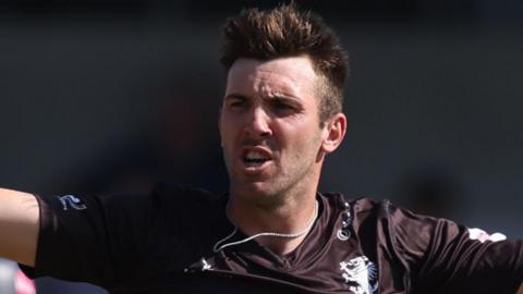 Craig Overton celebrates taking a wicket
