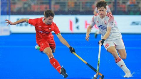 Wales' Gareth Griffiths goes up against England's Thomas Sorsby