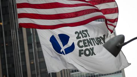 A 21st Century Fox flag flies outside the News Corporation building in Midtown Manhattan, December 14, 2017 in New York City.