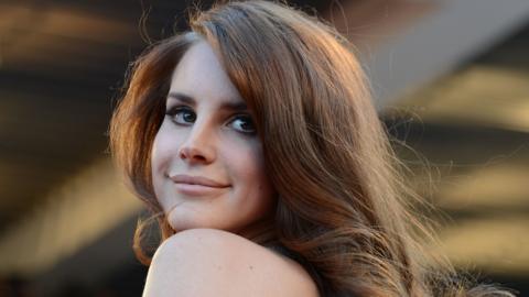 US singer Lana Del Rey poses on the red carpet before the screening of "Moonrise Kingdom" and the opening ceremony of the 65th Cannes film festival on May 16, 2012 in Cannes