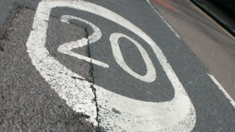 20 mph painted on the road