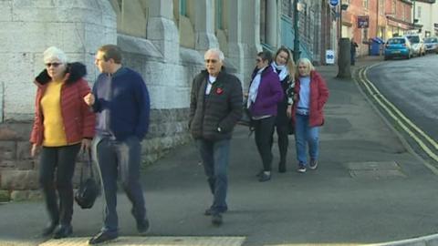 People arriving at court