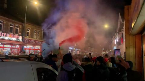 Fans celebrate in Cardiff street