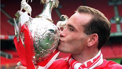 Wrexham striker Gary Bennett kisses the Welsh Cup